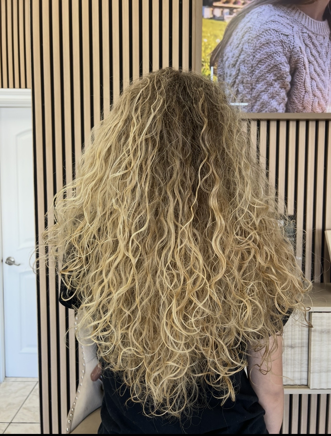 Voluminous blonde curls at M Vogue Beauty Salon