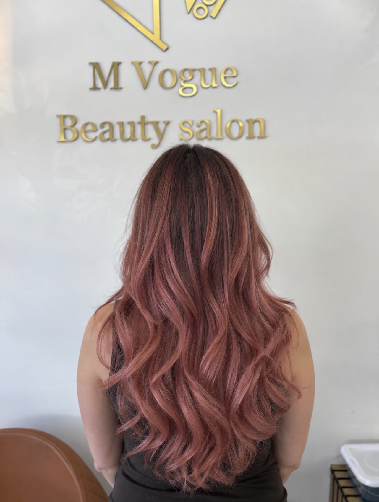 Rose-gold waves under the M Vogue salon sign