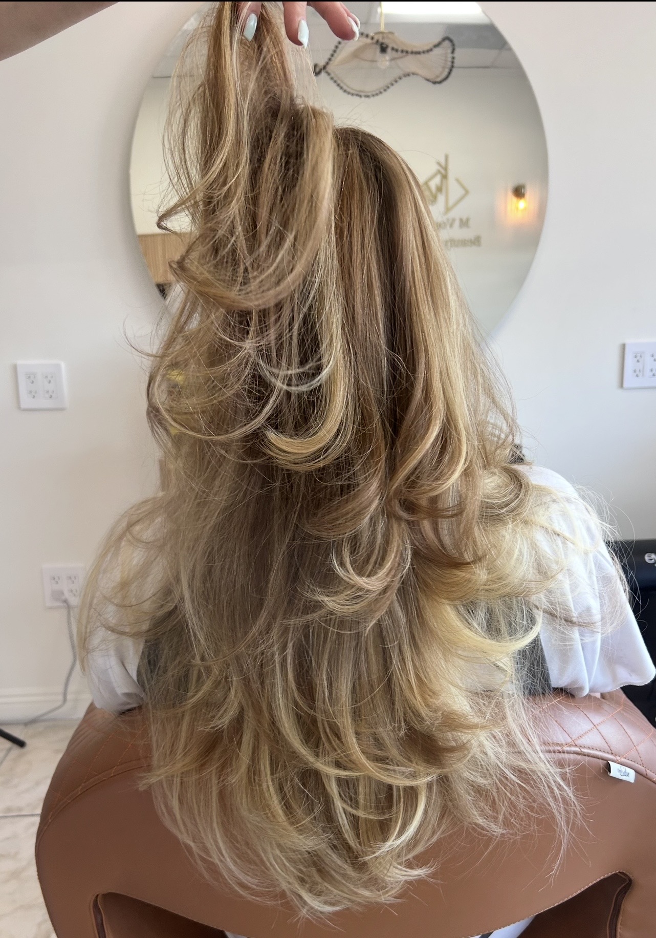Bouncy blonde layers at M Vogue Beauty Salon